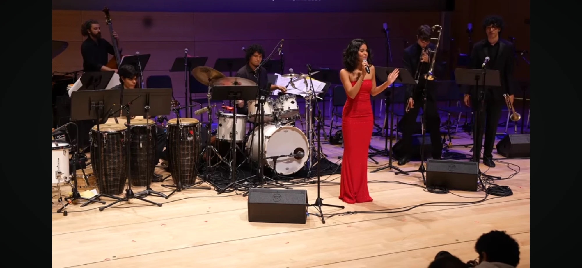Full band on a concert hall stage